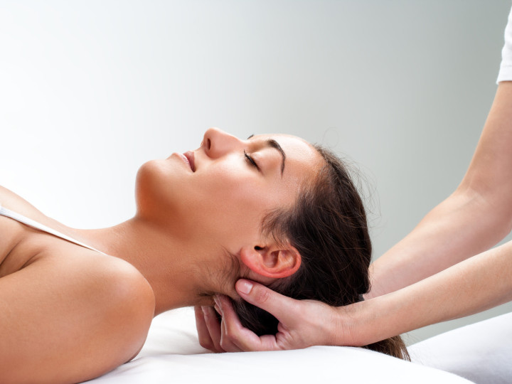 Close,Up,Of,Chiropractor,Pressing,Back,Of,Head.,Therapist,Doing